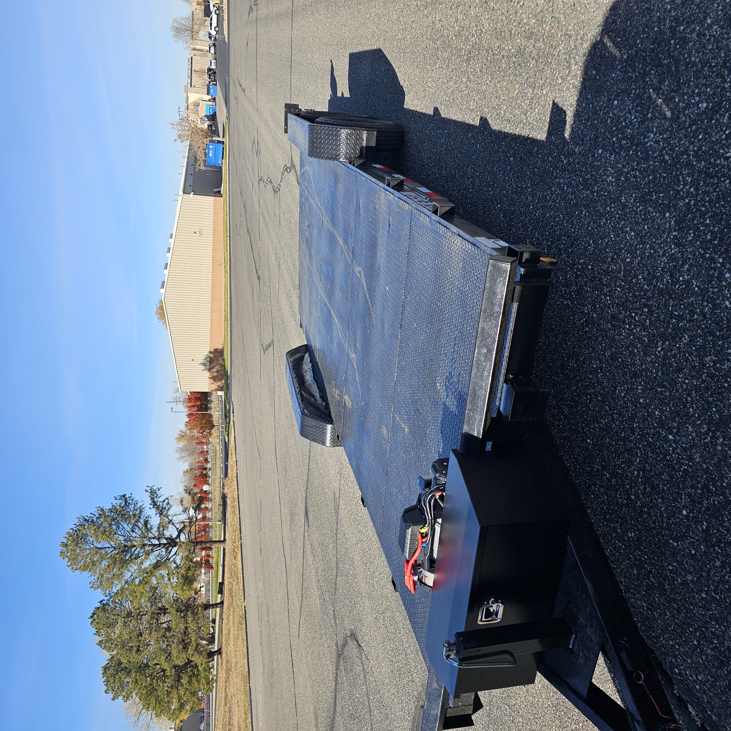 20ft Texo flatbed car hauler trailer with diamond plate steel deck and removable fenders for rent in Frederick Colorado